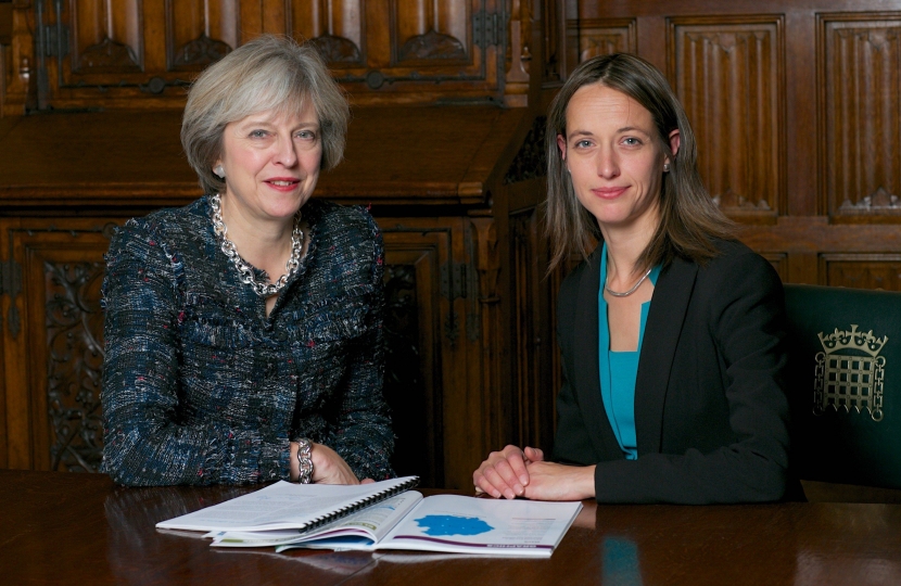Theresa May and Helen Whately