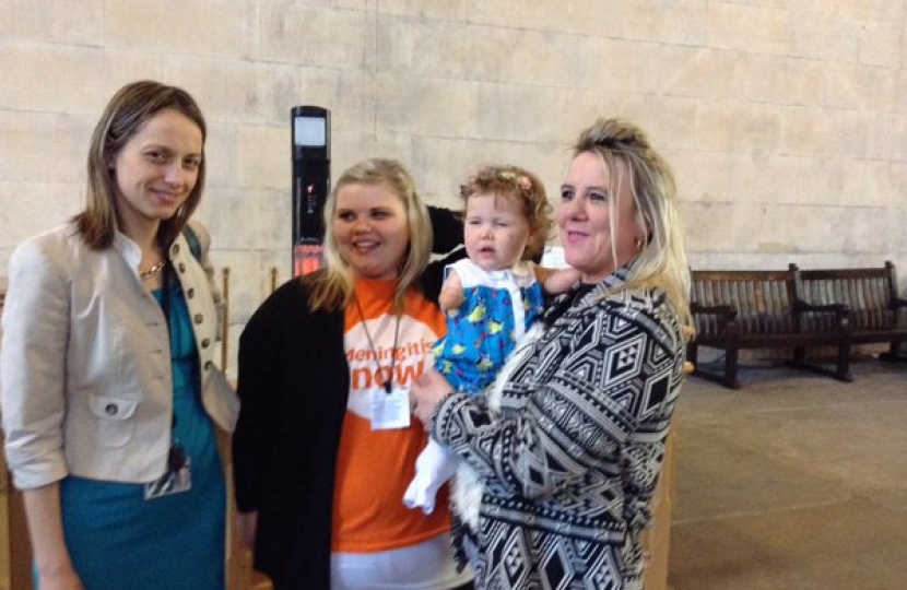 Helen with meningitis survivor Harmonie Rose and her family