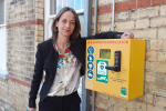Helen with a newly installed defibrillator at Bearsted station