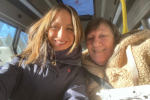 Helen with a passenger aboard the bus