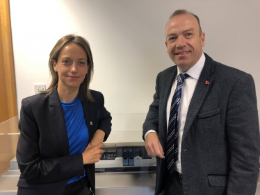 Helen Whately and the Rail Minister in front of a model of a class 700 Thameslink train